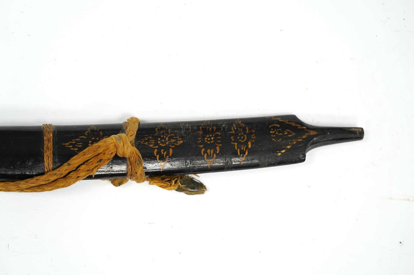 A Thai sword Dha, with a lacquered hilt and wooden scabbard, blade 56cm. Condition - fair